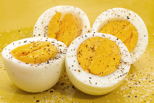 Boiled eggs on a yellow background