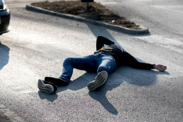 istock Traffic accident. Young man hit by a car 1211023779