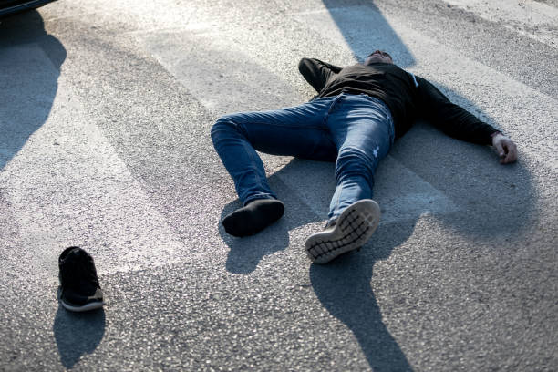 istock Traffic accident. Young man hit by a car 1211025090