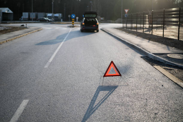 istock Young man calling for help because of a car accident. 1211025106