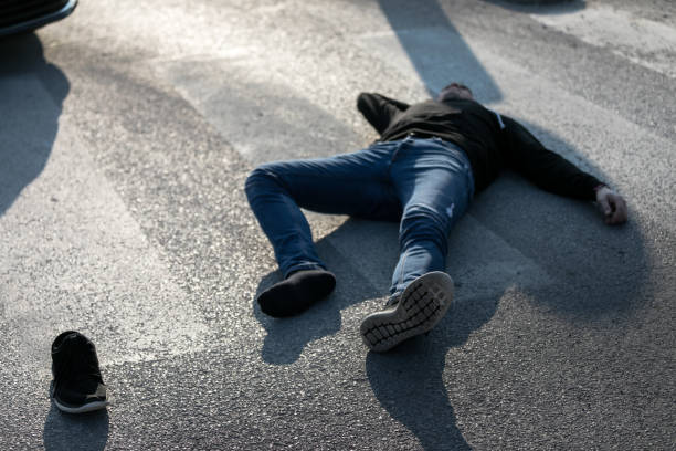 istock Traffic accident. Young man hit by a car 1211025134