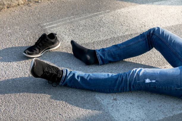 istock Traffic accident. Young man hit by a car 1211025203