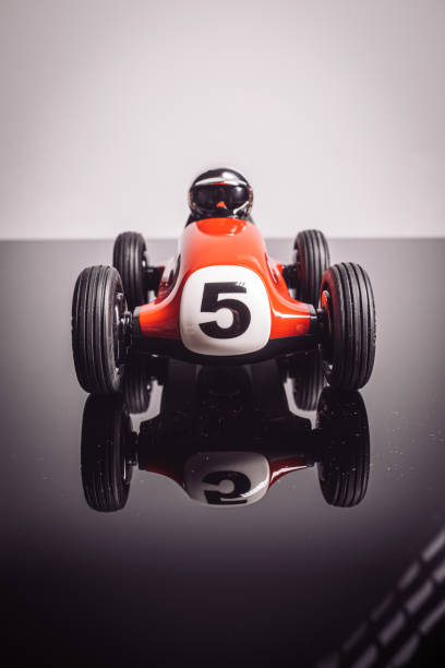 istock Red old racing car with number five painted on it 1211025209