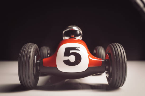 istock Red old racing car with number five painted on it 1211025220