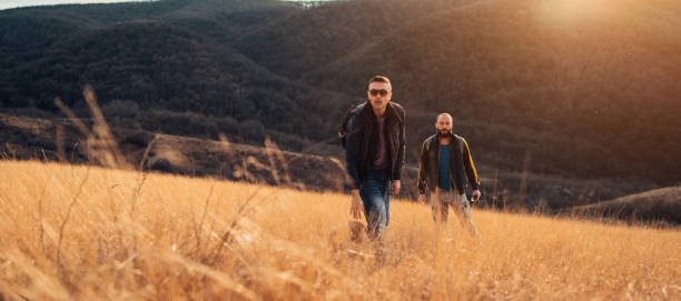 istock Two friends hiking in the hills 1211029398