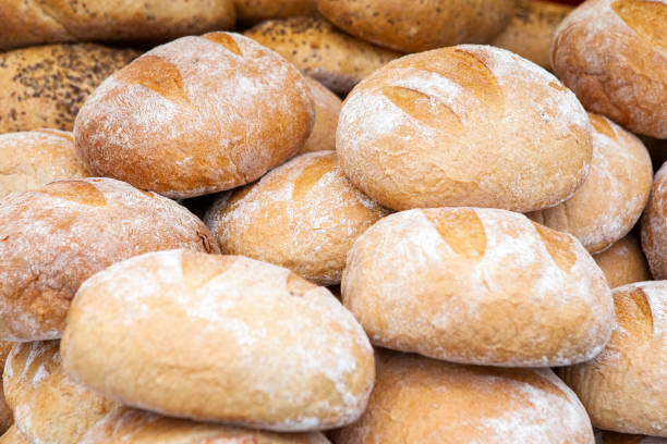 istock Fresh and crispy round bread on a market stall 1211030616