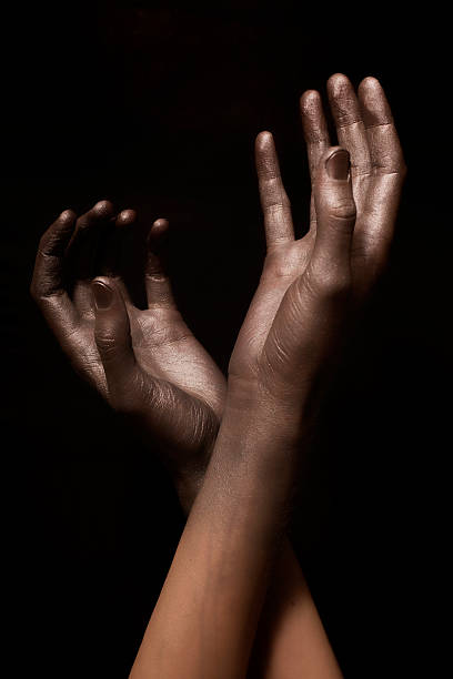 istock beautiful man's hands in gold paint 121103109