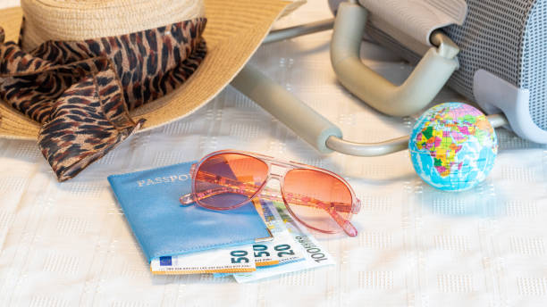 Vacation theme - passport, money with sun hat and bag