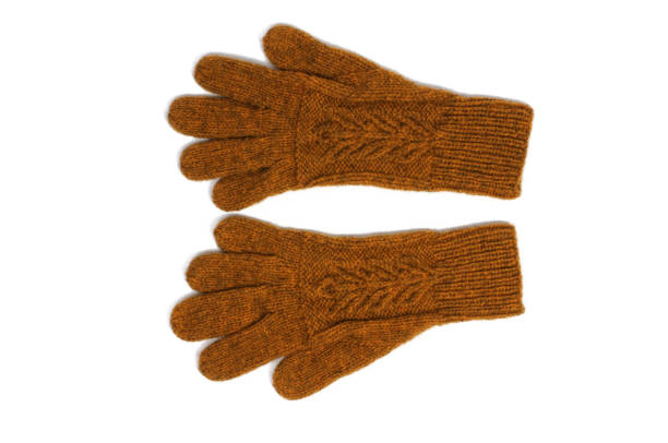 istock Yellow handmade gloves on white background. 1211033374
