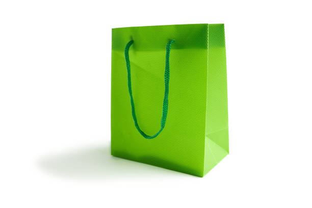 istock light green bag mockup for design isolated on a white background. space for text. sale concept. 1211034249