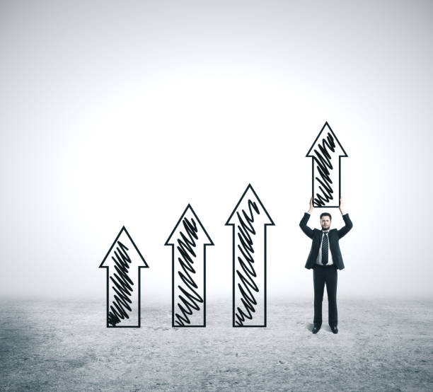 istock Businessman holding drawing arrow. 1211034286