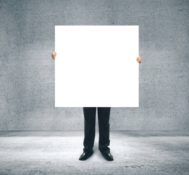 istock Businessman holding blank billboard 1211034348