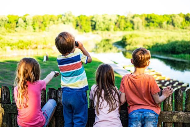Siblings relaxing in the city park