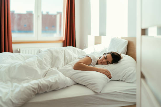 istock Woman sleeping in the bed 1211039492