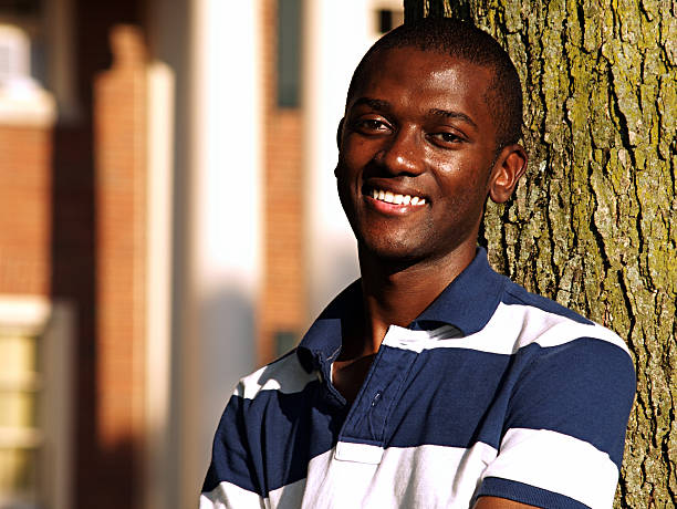 Smiling Young Man a smiling black young man. oxford ohio photos stock pictures, royalty-free photos & images