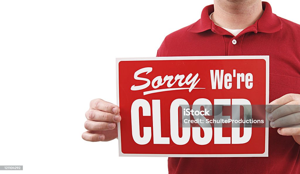 Closed Sign Man a man holding a closed sign isolated on white. Market Vendor Stock Photo