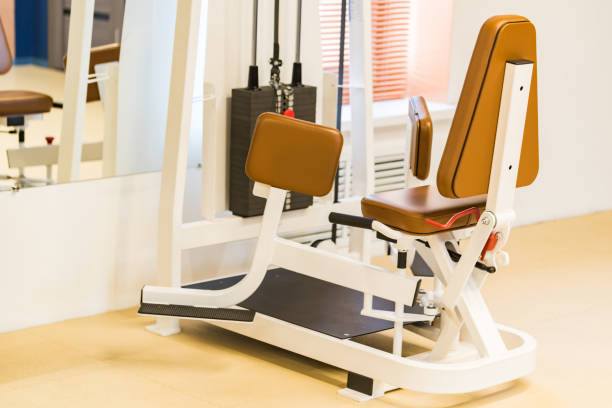istock Abductor machine for legs spreding in modern gym 1211043000