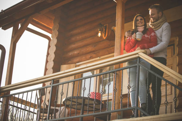 istock Couple enjoying fresh air outdoors and cuddling to keep each other warm 1211045512