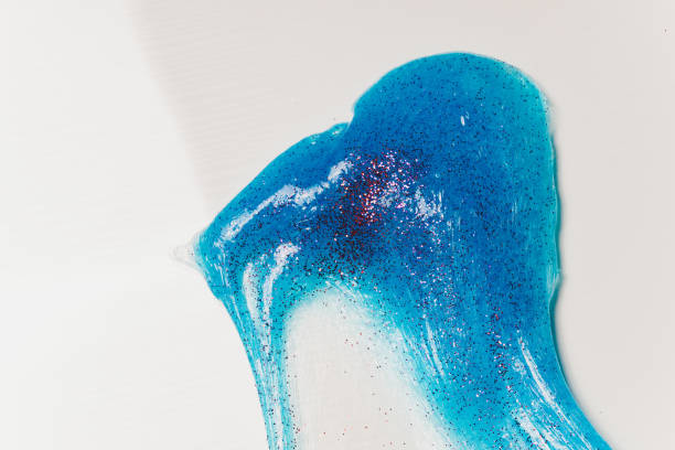 istock Kid Playing Hand Made Toy Called Slime Alien drool Shell mussel. 1211046204