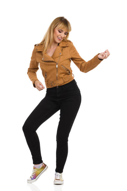 istock Young Woman Is Smiling And Playing Air Guitar 1211046323