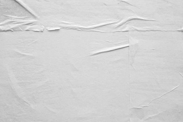 istock Blank white crumpled and creased paper poster texture background 1211046364