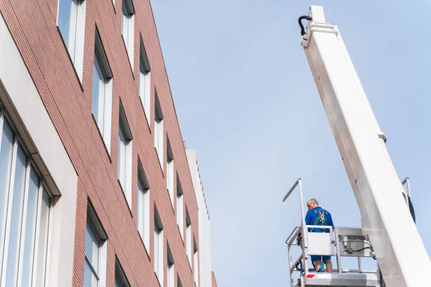 istock Lifting platform operator working on the street in Harlem, NYC 1211046906