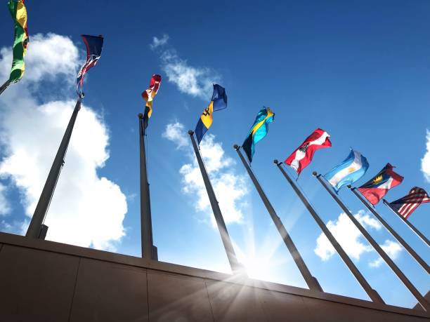 istock Close up group of colorful various countries flags at flagpoles 1211049244