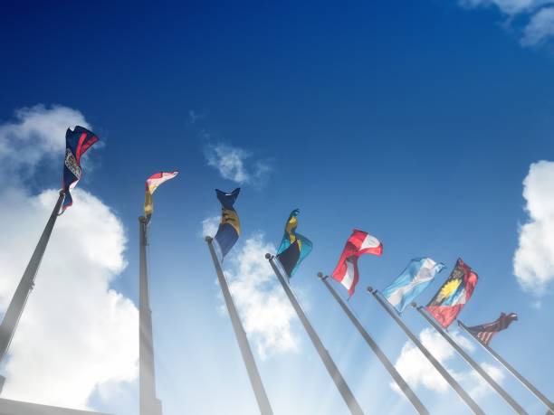 istock Close up group of colorful various countries flags at flagpoles 1211049246