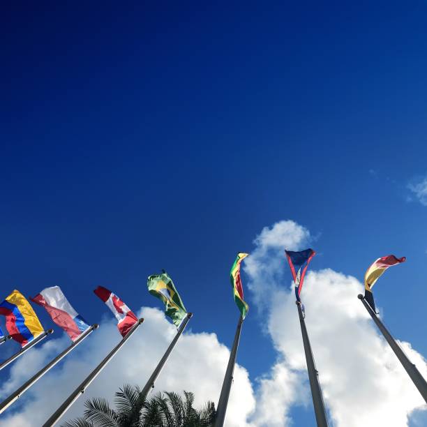istock Close up group of colorful various countries flags at flagpoles 1211049248