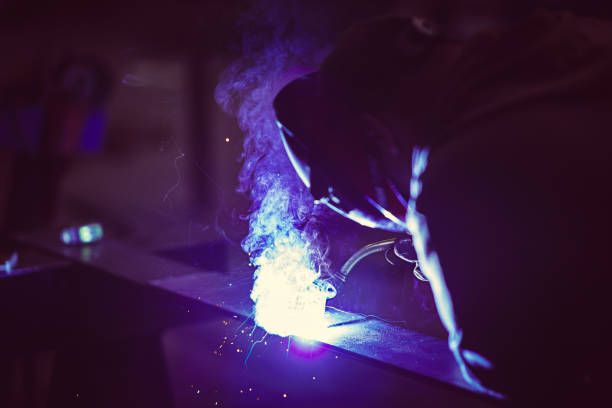 istock Professional welder with protection mask 1211051038