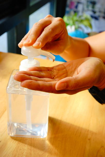 istock Hand cleaning by sanitizer in Pump bottle 1211051067