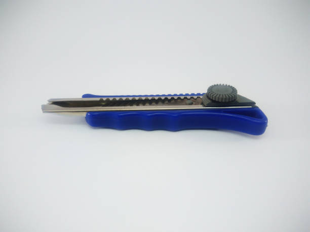 istock Blue Office Paper Knife Isolated On a White Background 1211051078