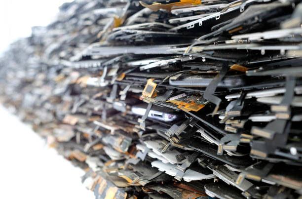 Big stack of old broken mobile phones and smartphones