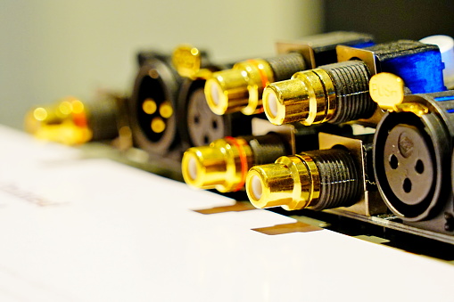 Gold female RCA jack on audio amplifier connector.