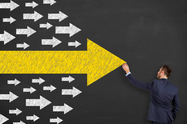 istock Leadership Concepts with Arrows on Chalkboard Background 1211055042