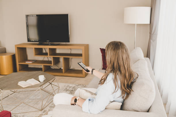 istock Woman relaxing at home 1211058126