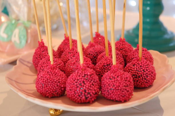 istock Cake pop, pink sugar candy. Easy to eat and makes difference at the table. Homemade dessert to decorate the party table. 1211059664
