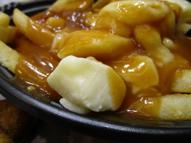 istock Bright Delicious Canadian Poutine Topped with Gravy 2020 1211061586