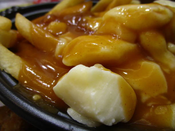 istock Bright Delicious Canadian Poutine Topped with Gravy 2020 1211061587
