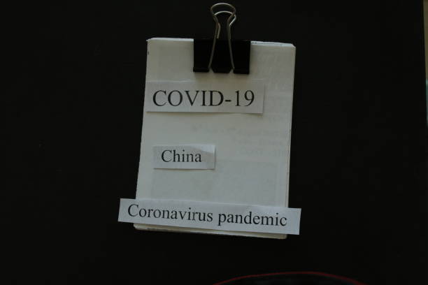 istock COVID-19, China, and Corona virus on a note pad 1211061935