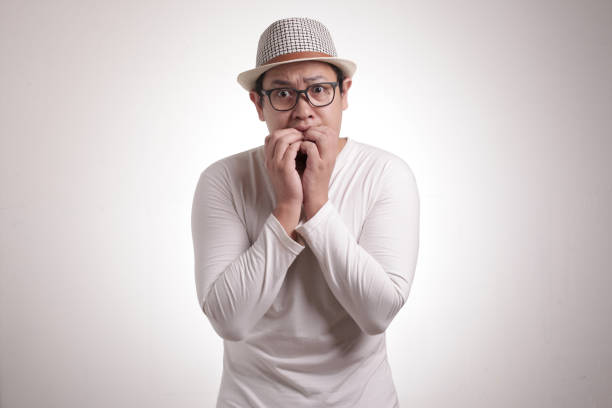 istock Young Man Nervous Afraid or Worried of Something 1211063988