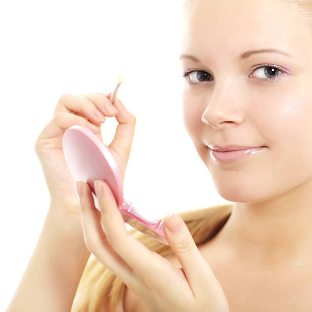 istock Teenage Girl Applying Make Up 121106601