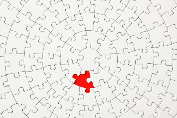 istock Missing piece of a blank jigsaw puzzle 1211068839