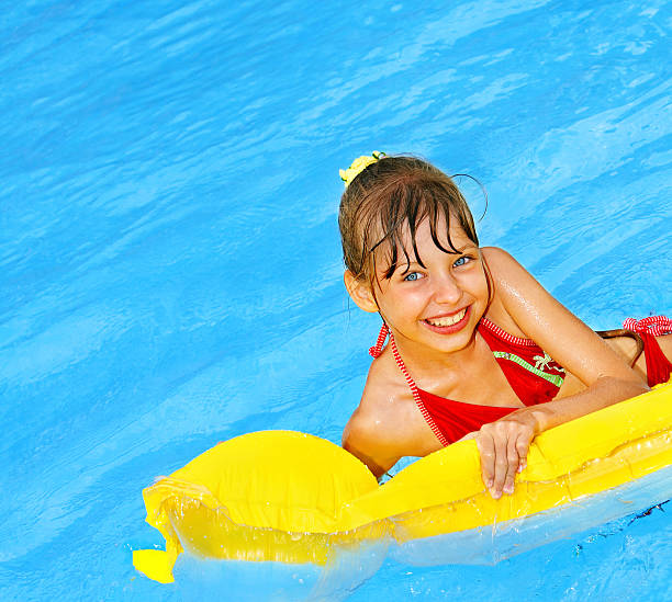 istock Child swimming on inflatable beach mattress. 121106900