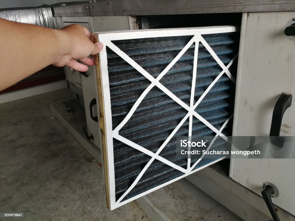 Soft Focus to Filter of Air handing Unit, Technician checking a Pre-filter of air handling unit for replacement a new filter - HVAC maintenance Filtration Stock Photo
