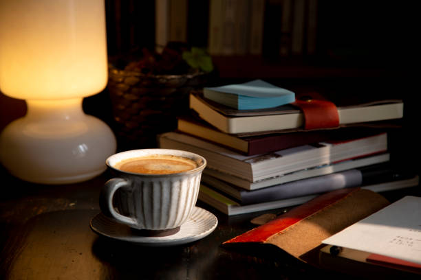 istock coffee break: books, notebook and coffee on wooden table 1211075410