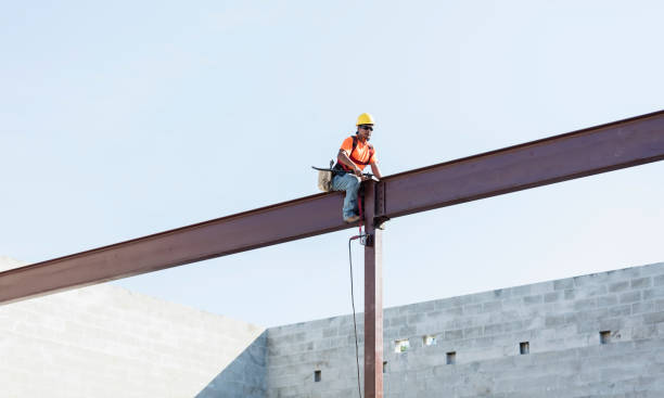 Hispanic ironworker working on a steel girder