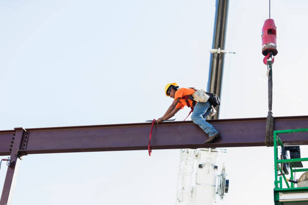 istock Hispanic ironworker working on a steel girder 1211076217