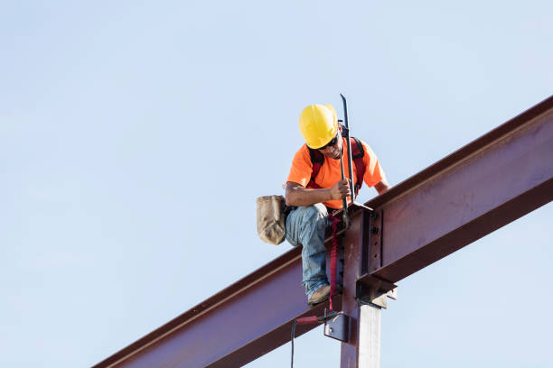 istock Hispanic ironworker working on a steel girder 1211076236