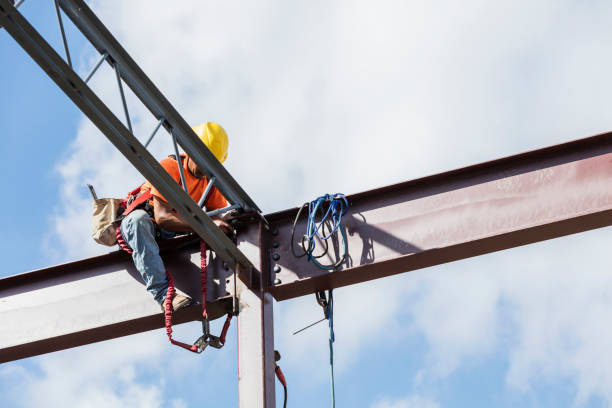 istock Ironworker at construction site installing roof joist 1211076238